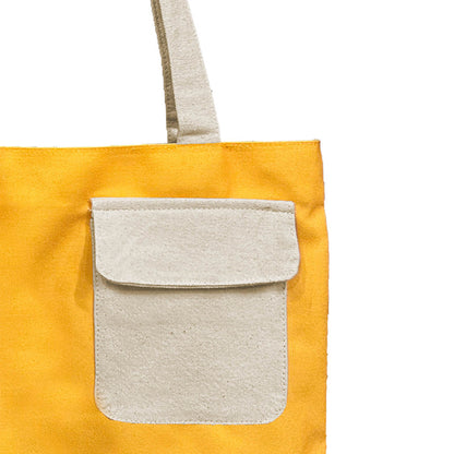  Vibrant yellow tote bag with a contrasting white pocket for added style.