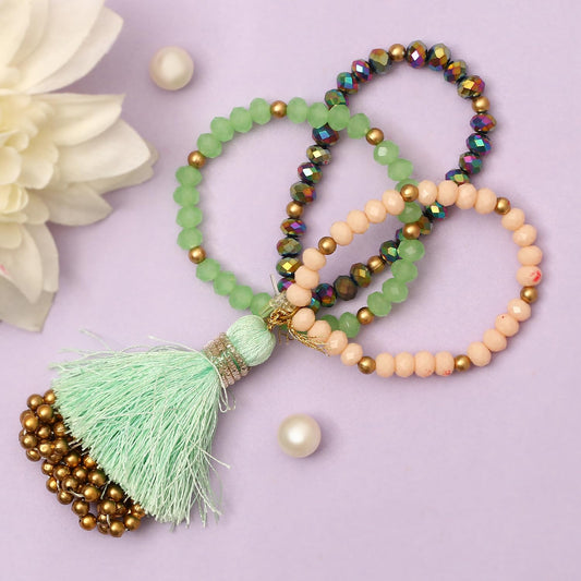  A stylish bracelet with colorful beads and a tassel resting on a wooden table, adding a pop of color to the scene.