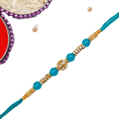 Celebrate Raksha Bandhan with a stunning blue and gold rakhi with crystal bead.