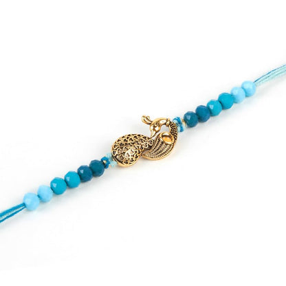 A blue string featuring a shiny gold clasp and a charming gold charm hanging from it.
