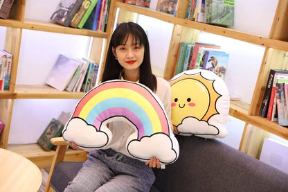 Two colorful pillows featuring a sun and a rainbow design, adding a touch of brightness and cheerfulness to any space.