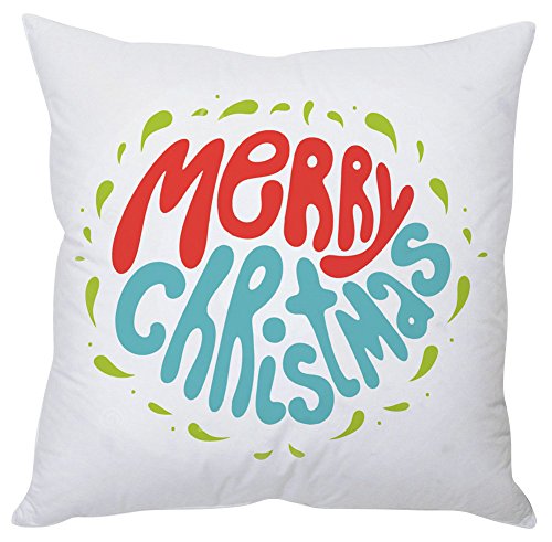 A white pillow featuring the phrase "Merry Christmas" in festive lettering.

