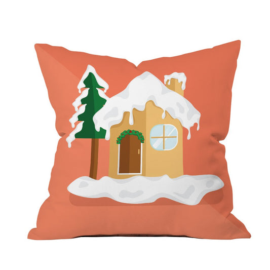 A cozy pillow featuring a charming house design, surrounded by soft snowflakes for a wintery touch.