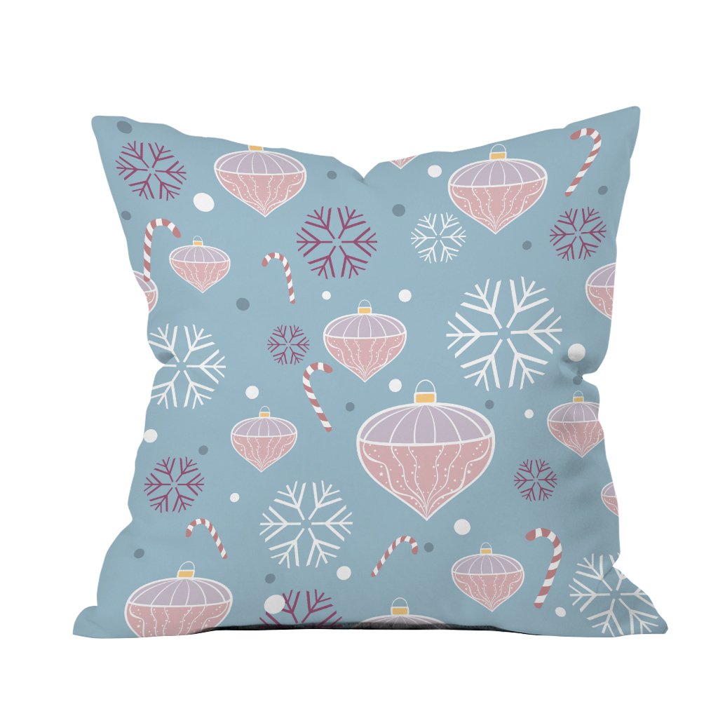 A cozy blue pillow adorned with white snowflakes and festive candy canes, perfect for holiday decor.
