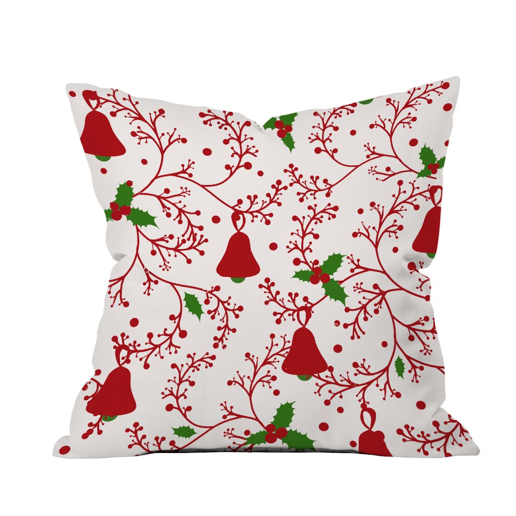 A festive red and white Christmas pillow adorned with holly and bells, perfect for holiday decor.