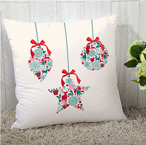 Three colorful Christmas ornaments resting on a soft white pillow, creating a festive and cozy holiday atmosphere.
