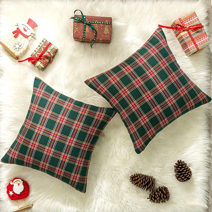 A duo of pillows showcasing vibrant plaid patterns, perfect for adding flair to your seating area.