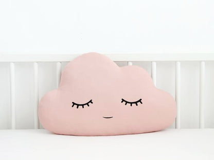 5. Three cozy pillows with cloud, star, and moon prints.