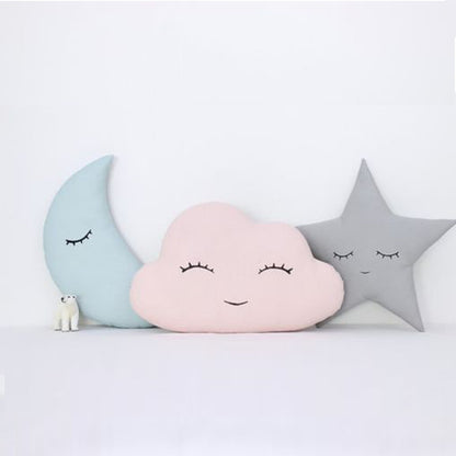 1. Three pillows featuring a cloud, star, and moon designs.