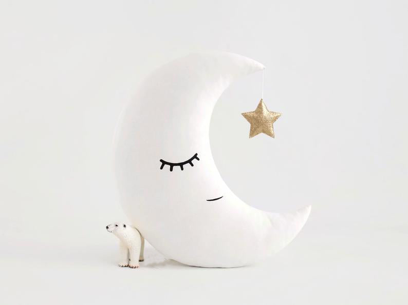 3. Pillows adorned with cloud, star, and moon patterns.