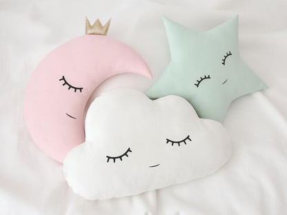 Decorative pillows with a moon and cloud design, set of three.