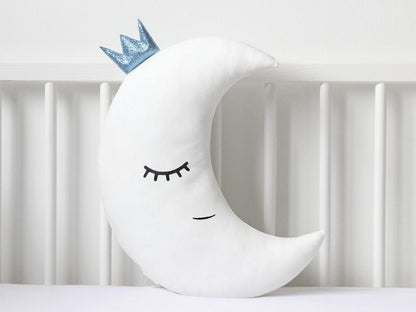 Add a playful touch to your room with these two white pillows featuring blue eyes and a star on top.