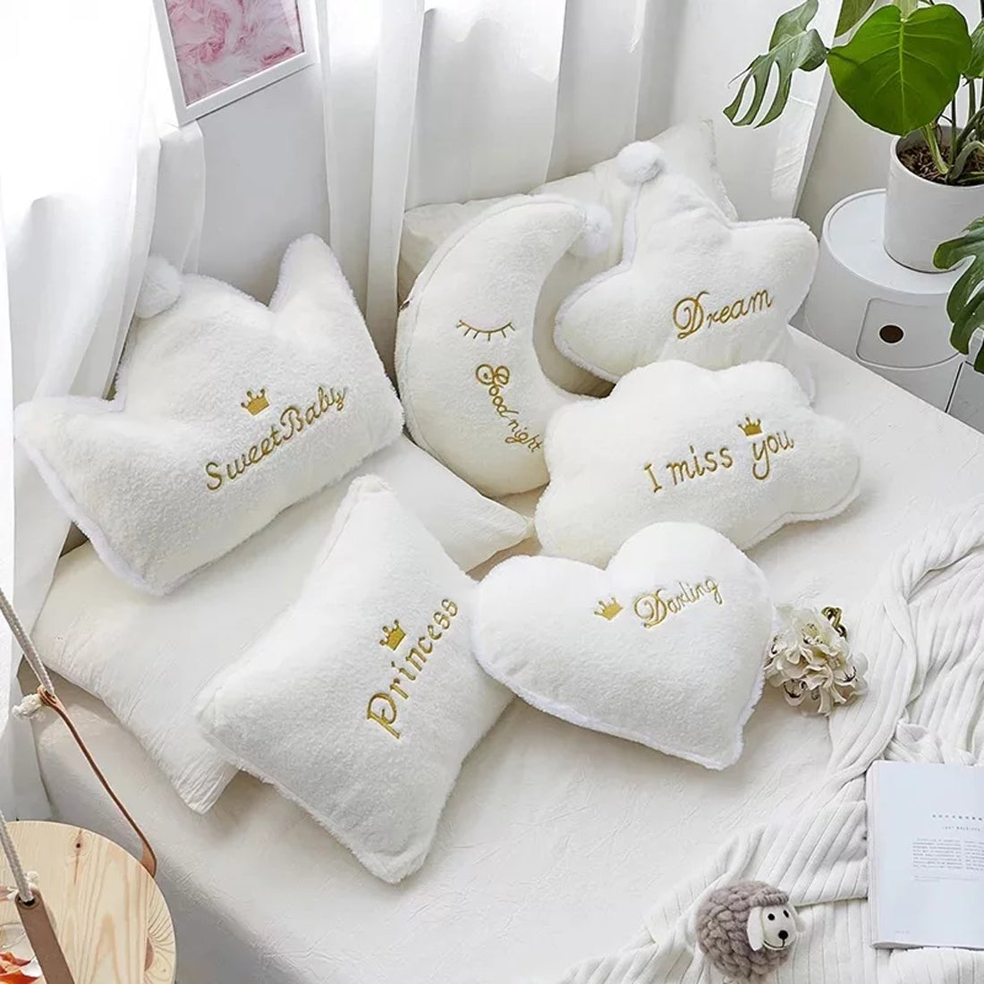 Decorative white pillow featuring the word "darling" in stylish lettering, perfect for adding a sweet accent.