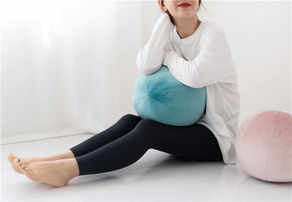 Colorful balls scattered on white floor.