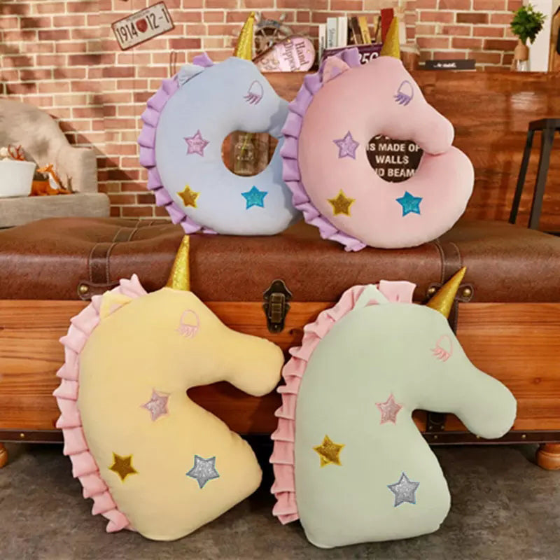 Pink unicorn head pillow with star pattern, perfect for adding a touch of magic to your bedroom decor.
