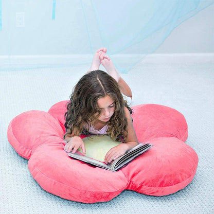 A pink flower-shaped cushion with a yellow center, adding a touch of elegance and comfort to any space.