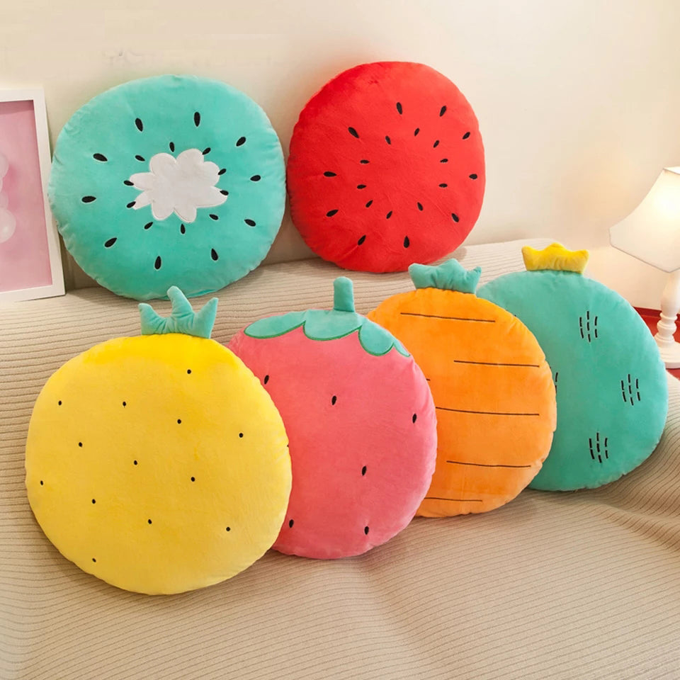 Large carrot pillow in orange hue placed on a bed.