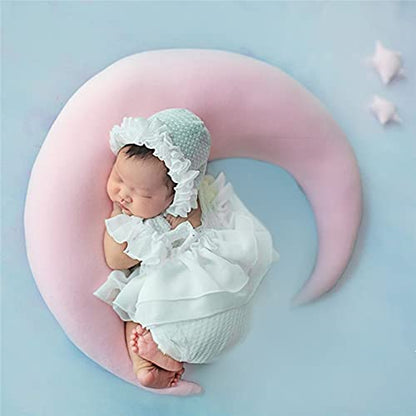 A peaceful newborn girl sleeping on a pink pillow