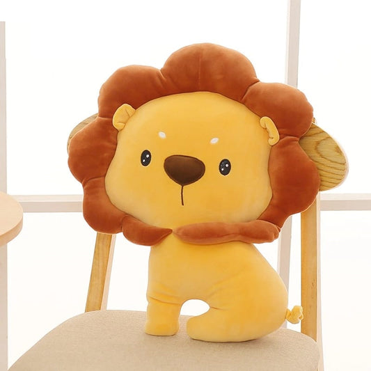 A lion sitting on a chair with a small stuffed animal next to it.