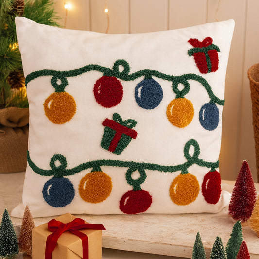 Decorative pillow with Christmas lights and presents on a festive background