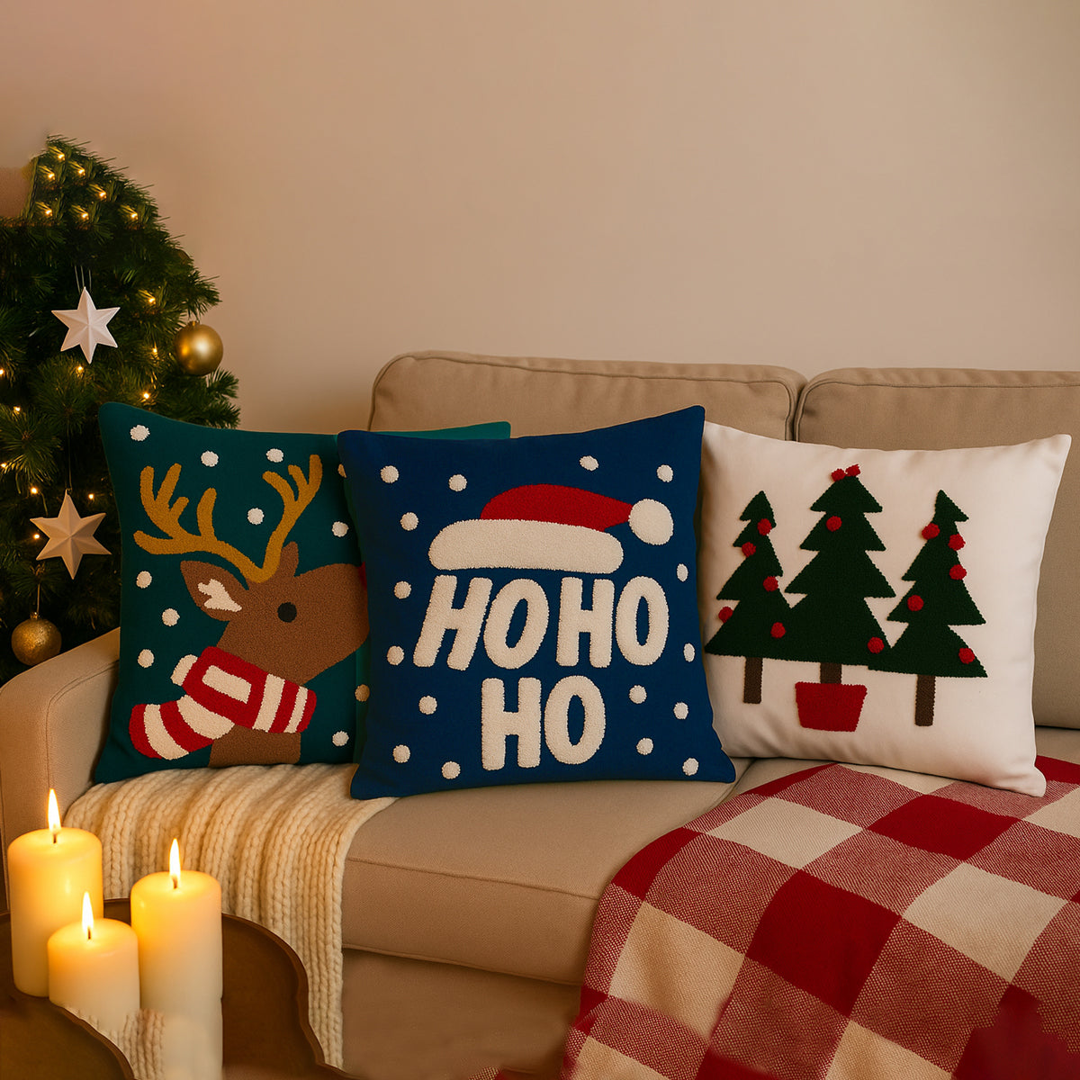 Decorative Christmas pillows on a couch with a Christmas tree in the background