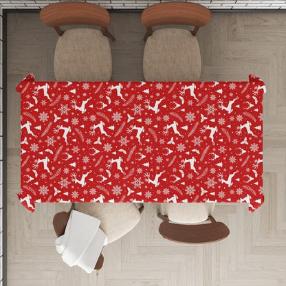  Festive red table cloth adorned with snowflakes and snowmen design.