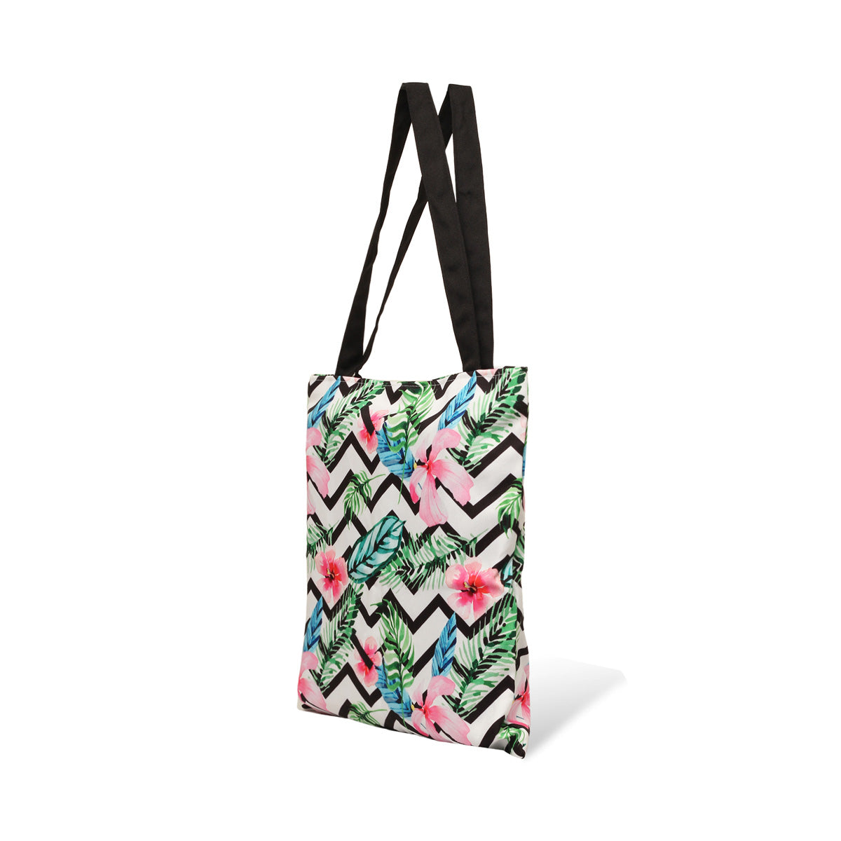 Tote bag adorned with colorful tropical print and black handles.