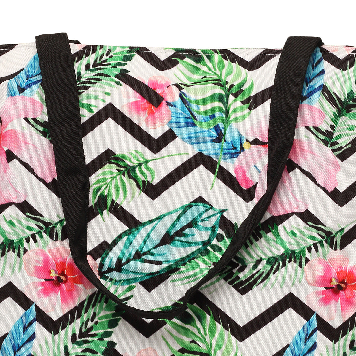 Tote bag adorned with colorful tropical print and black handles.