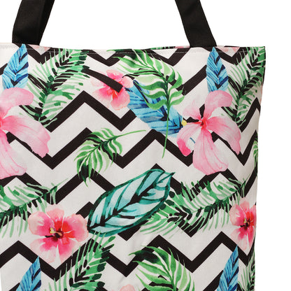 Tote bag adorned with colorful tropical print and black handles.