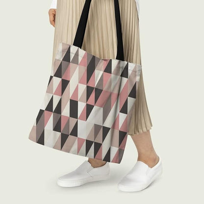 Chic tote bag in pink and black with geometric design.