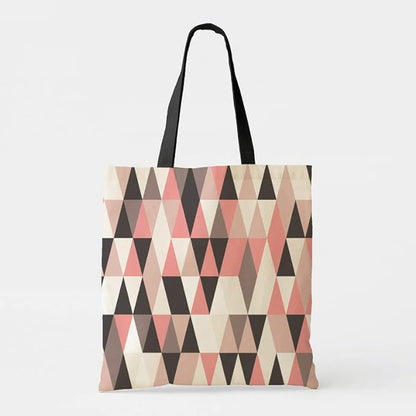 Trendy tote bag with pink and black triangle print.