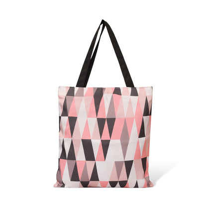 Fashionable pink and black tote bag adorned with triangles.