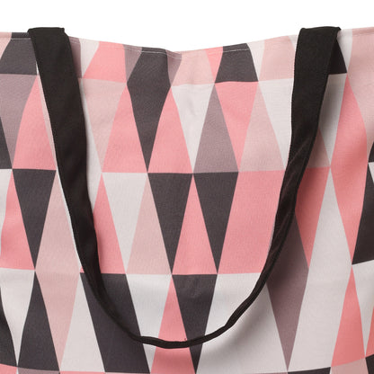 handle zzom view of Pink and black tote bag with triangle pattern.