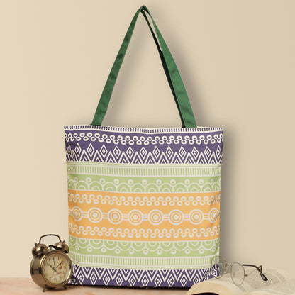 A vibrant tote bag with a green handle, perfect for adding a pop of color to your outfit. Colorful tote bag with green, orange, and yellow pattern, perfect for adding a pop of color to your outfit.