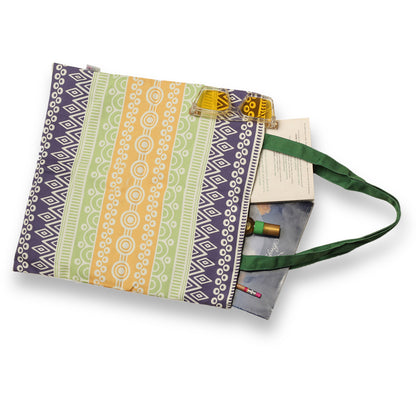 A vibrant tote bag with a green handle, perfect for adding a pop of color to your outfit.