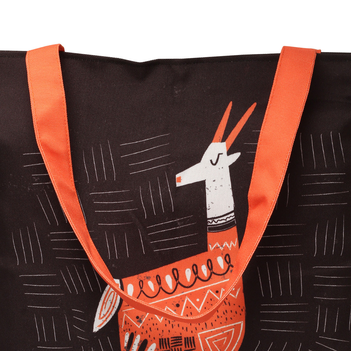 Black tote bag with an orange strap and a printed design of a white llama with orange and black geometric patterns.