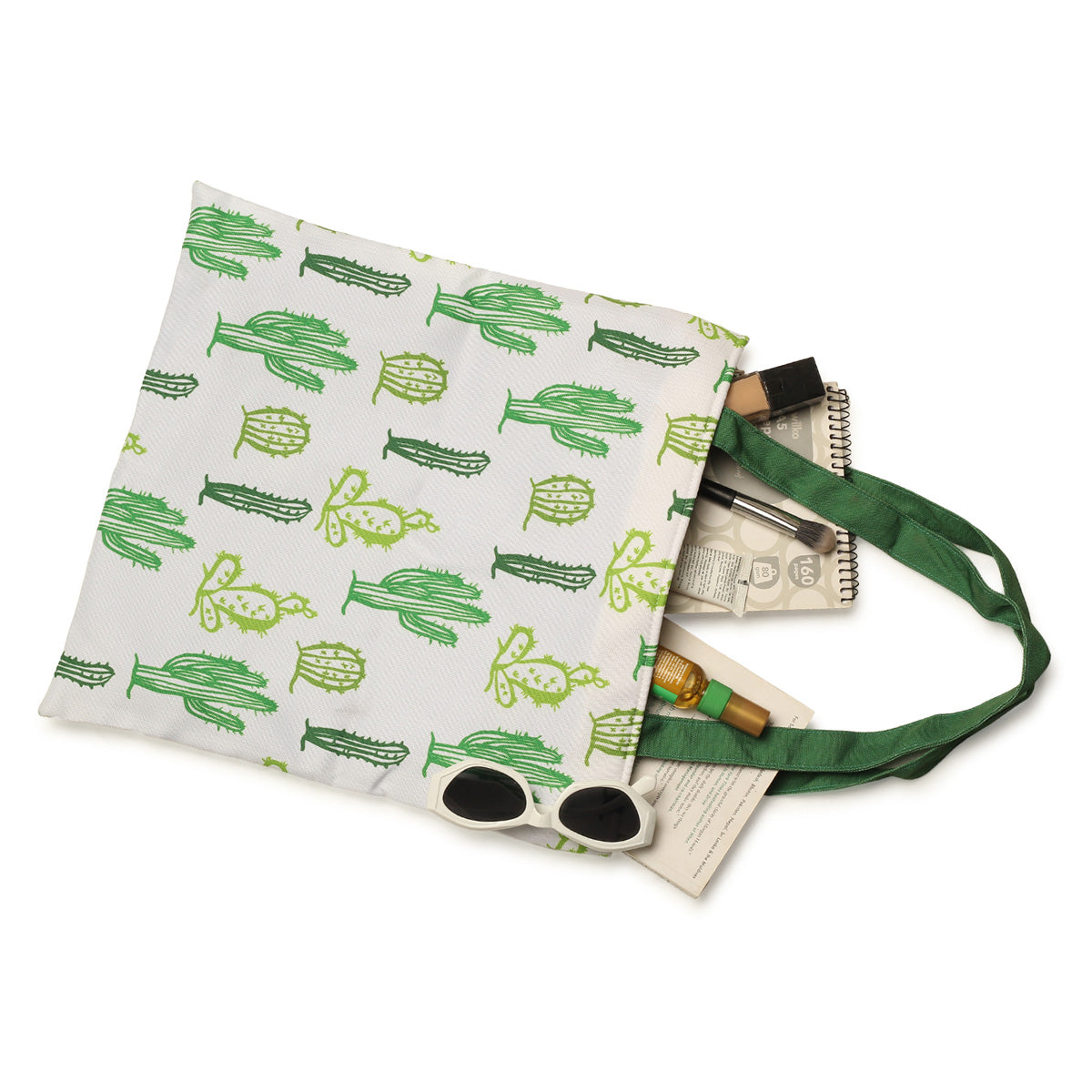 A stylish tote bag with a cactus print in green and white colors. Perfect for carrying your essentials with a touch of nature.