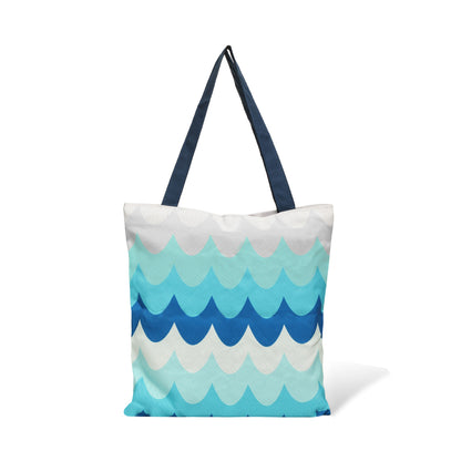 Stylish blue and white tote bag with a wave pattern, ideal for a day by the water or running errands.