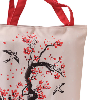 Embrace elegance with a tote bag adorned with a stunning cherry blossom motif, a fashionable accessory for any outfit.