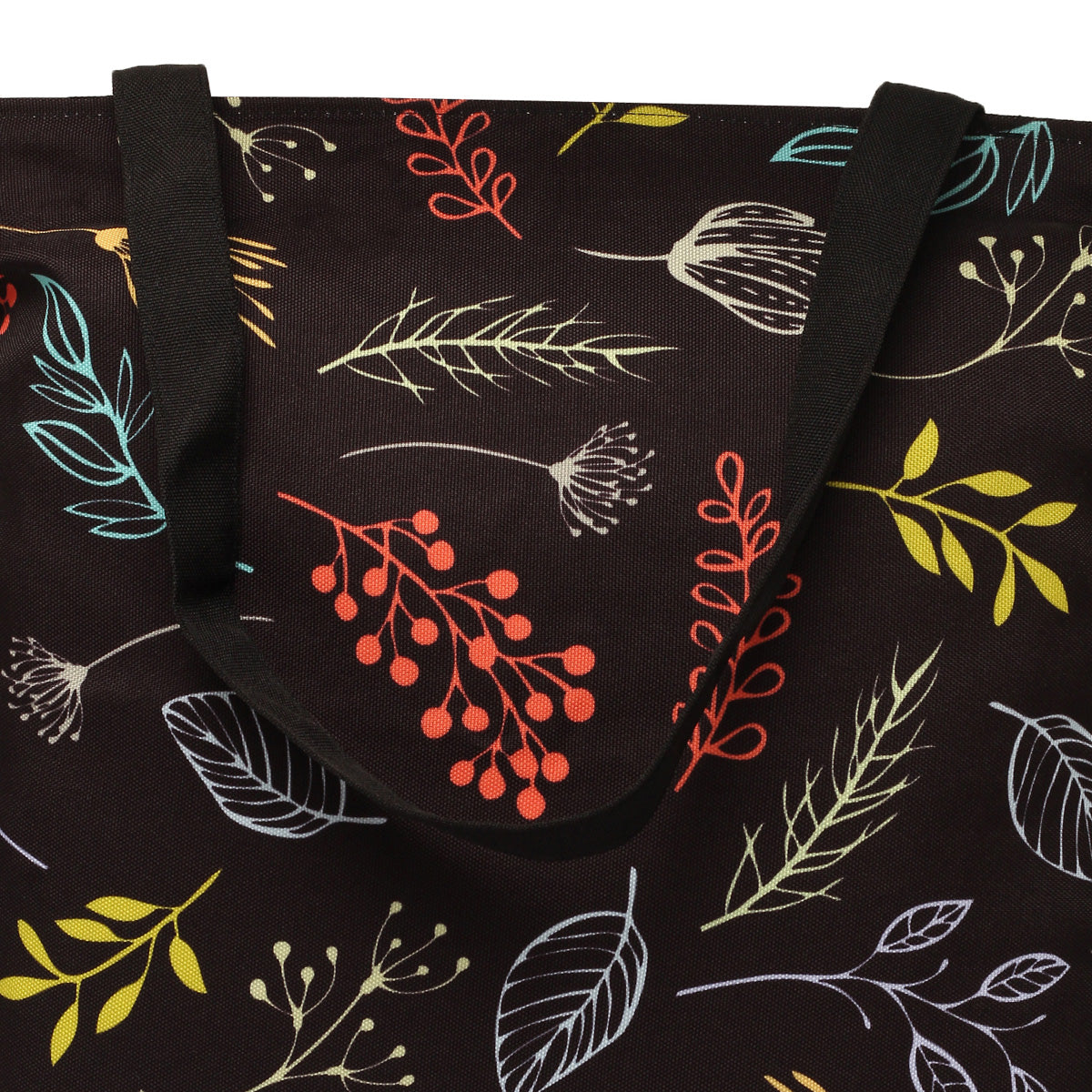 Zoom view of Black tote bag featuring colorful leaves and flowers.