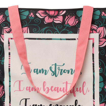 A tote bag with the quote "I am strong, I am beautiful, I am strong" on it.