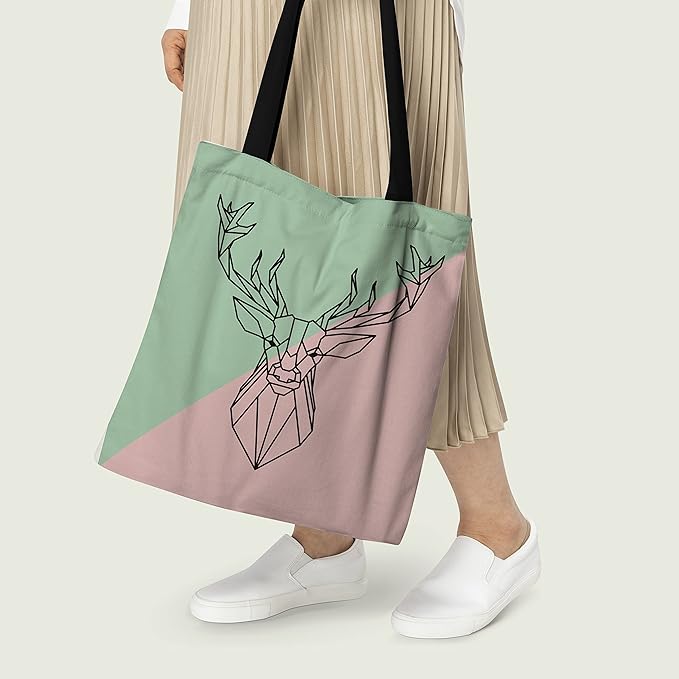 A stylish tote bag in pink and green with a deer head design. Perfect for adding a touch of nature to your outfit.