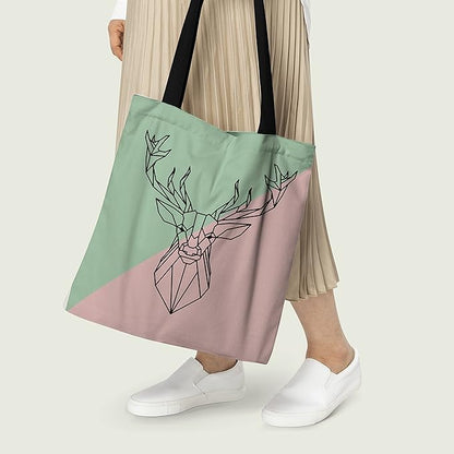 A stylish tote bag in pink and green with a deer head design. Perfect for adding a touch of nature to your outfit.