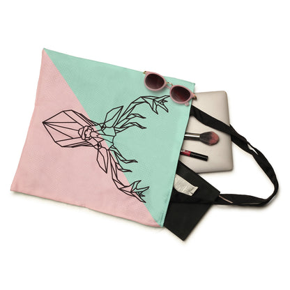 A stylish tote bag in pink and green with a deer head design. Perfect for adding a touch of nature to your outfit.