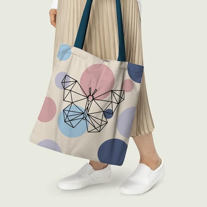 Women holding butterfly print tote bag with blue color handle