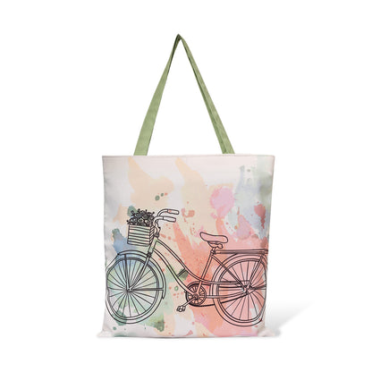 Trendy tote bag with a cute bicycle print, ideal for adding a pop of fun to your outfit.