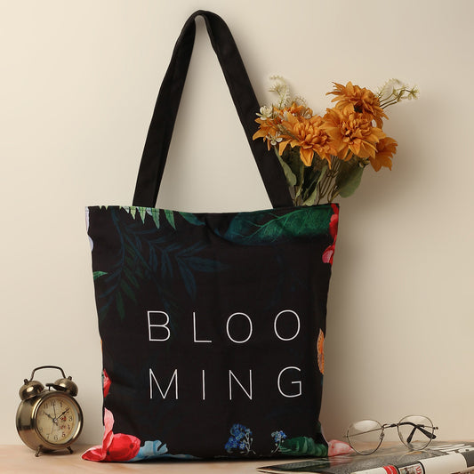 Colorful floral tote bag with vibrant blooms, perfect for adding a pop of color to your outfit.