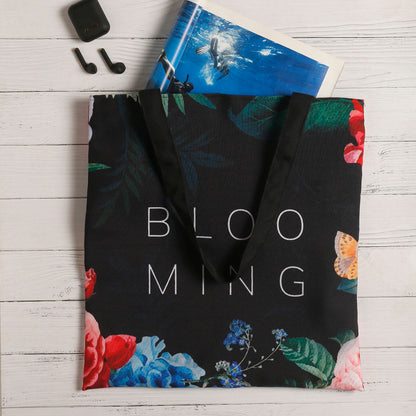 Stylish tote bag featuring a beautiful array of blooming flowers, adding a touch of nature to your look.