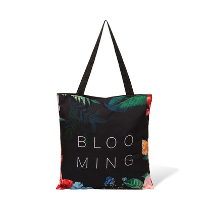 Black tote bag with Blooming written on it