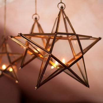  Gold star-shaped lights hanging from wooden ceiling.